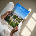 Malaga #2 Travel Poster - A4 print held in hand