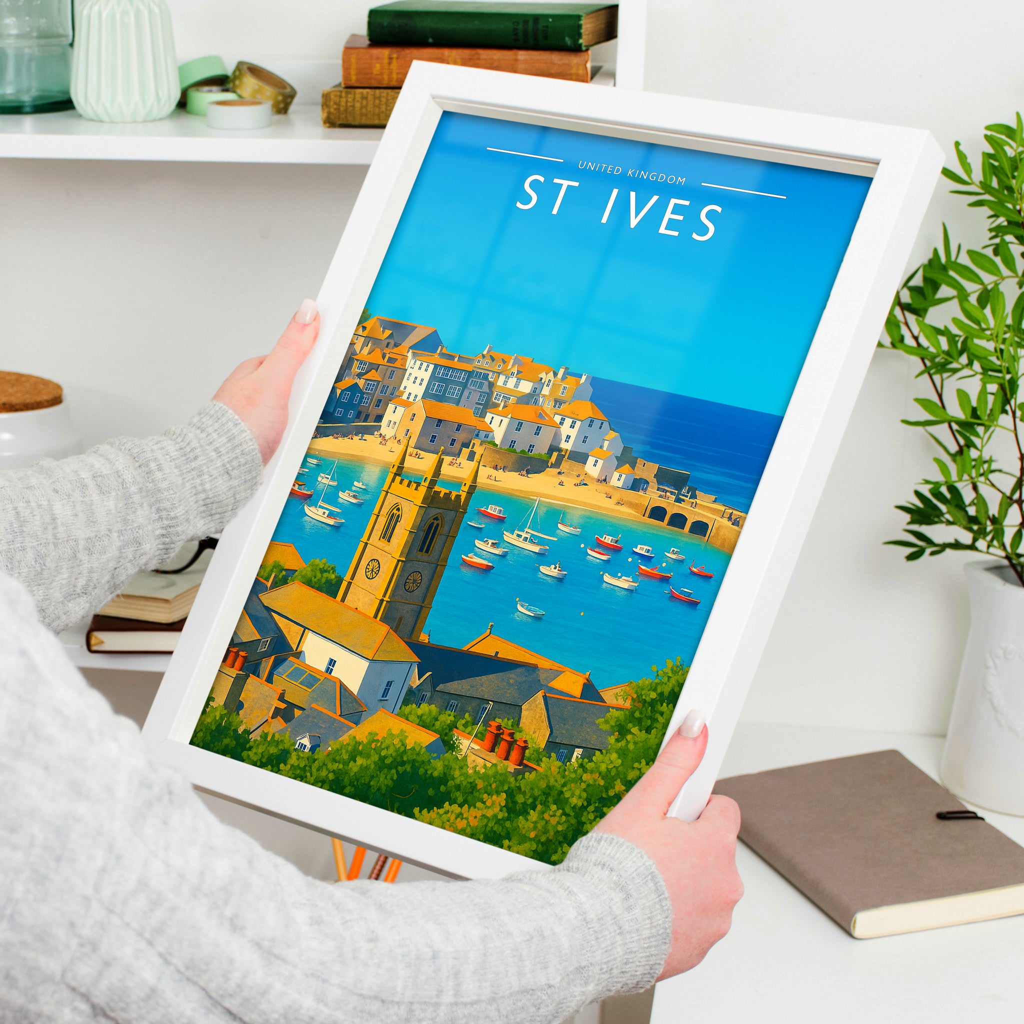 St Ives Travel Poster in a white frame, held to show scale