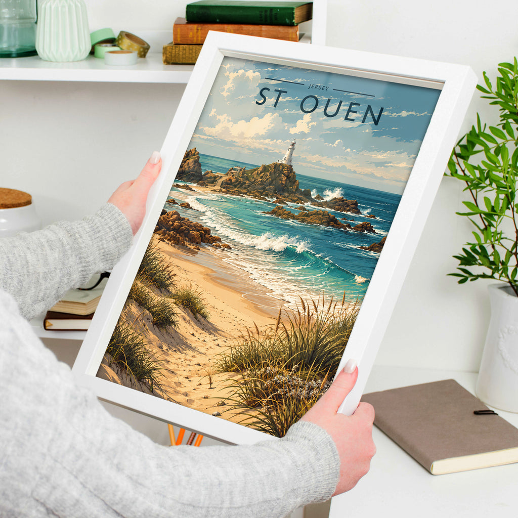 St Ouen Travel Poster in a white frame, held to show scale
