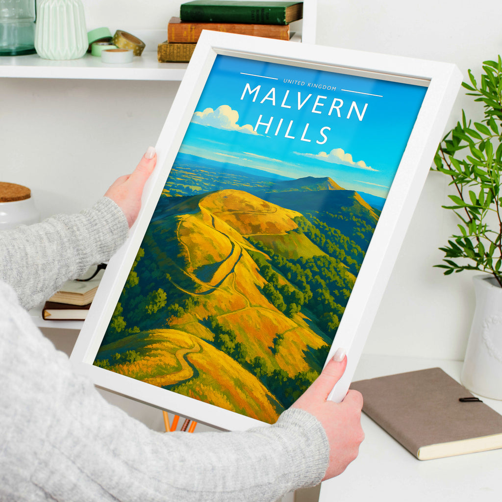 Malvern Hills Travel Poster in a white frame, held to show scale