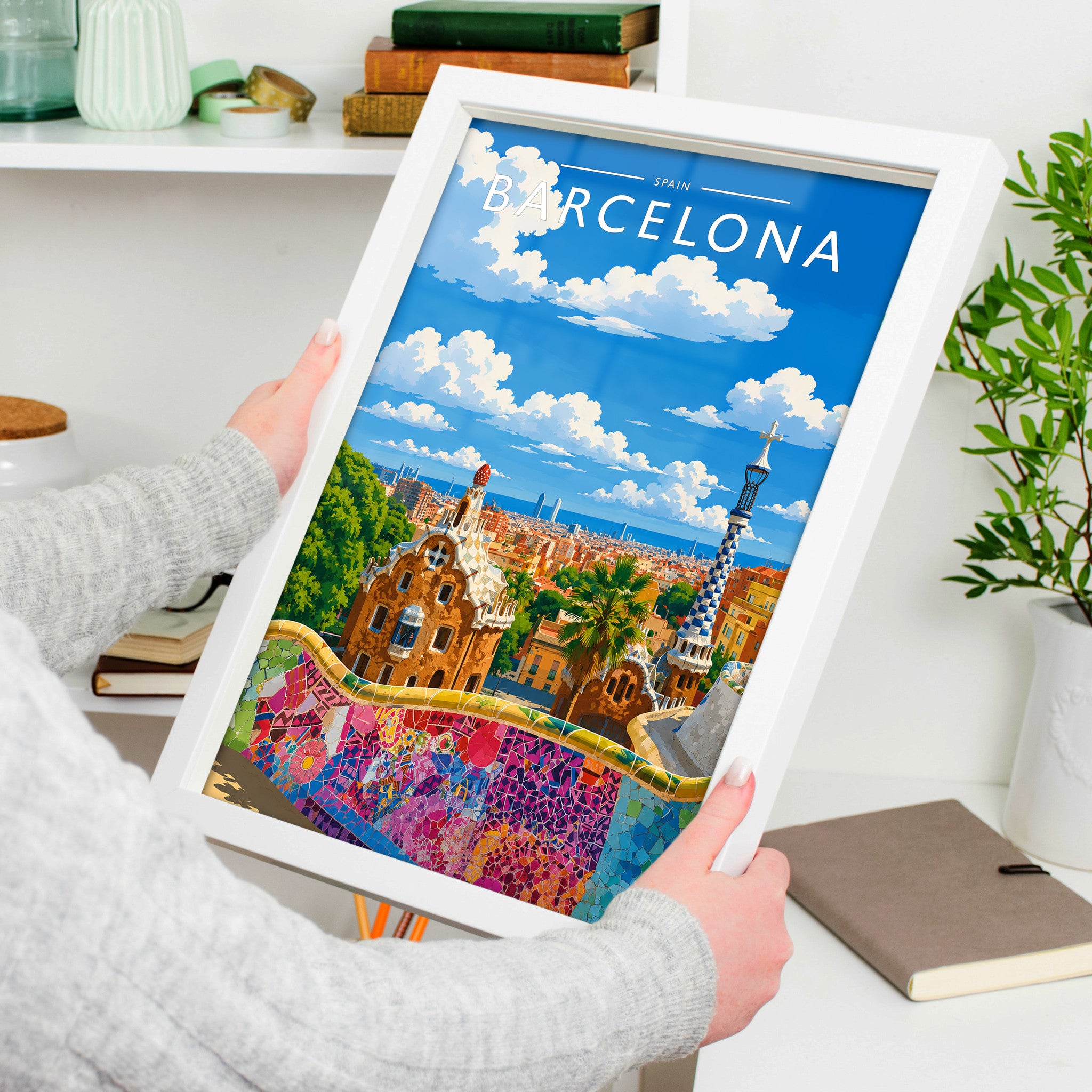 Barcelona #2 Travel Poster in a white frame, held to show scale