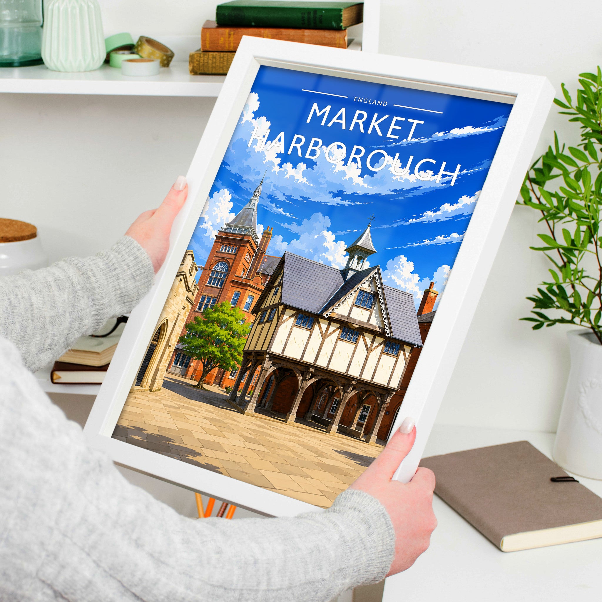Market Harborough #2 Travel Poster in a white frame, held to show scale