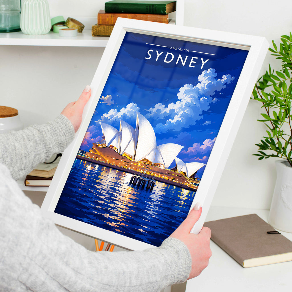 Sydney Travel Poster in a white frame, held to show scale
