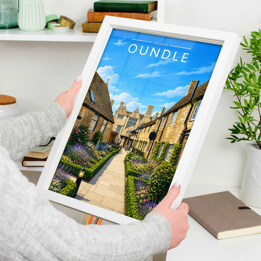 Oundle #3 Travel Poster in a white frame, held to show scale