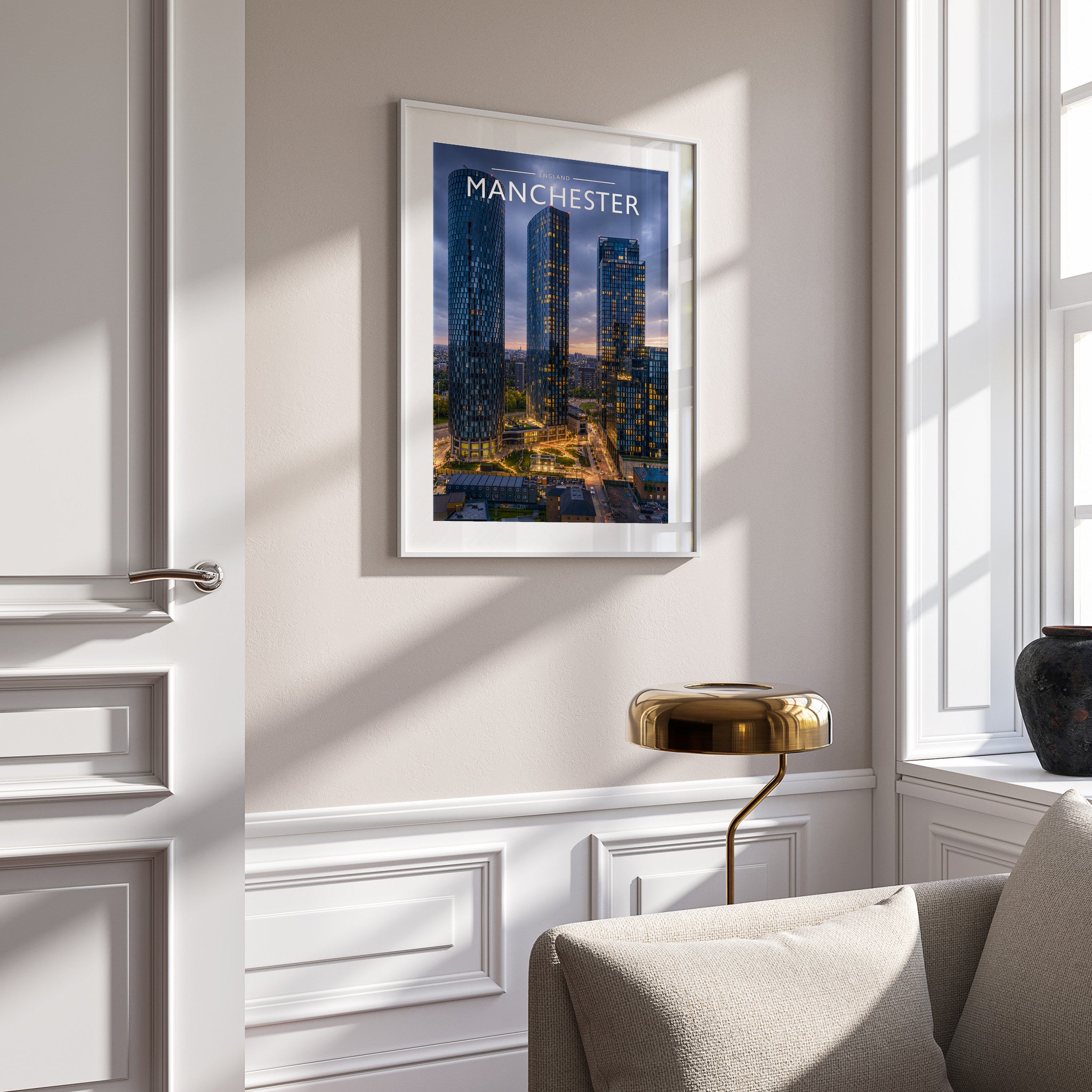 Manchester Travel Poster in a white frame on a panelled wall
