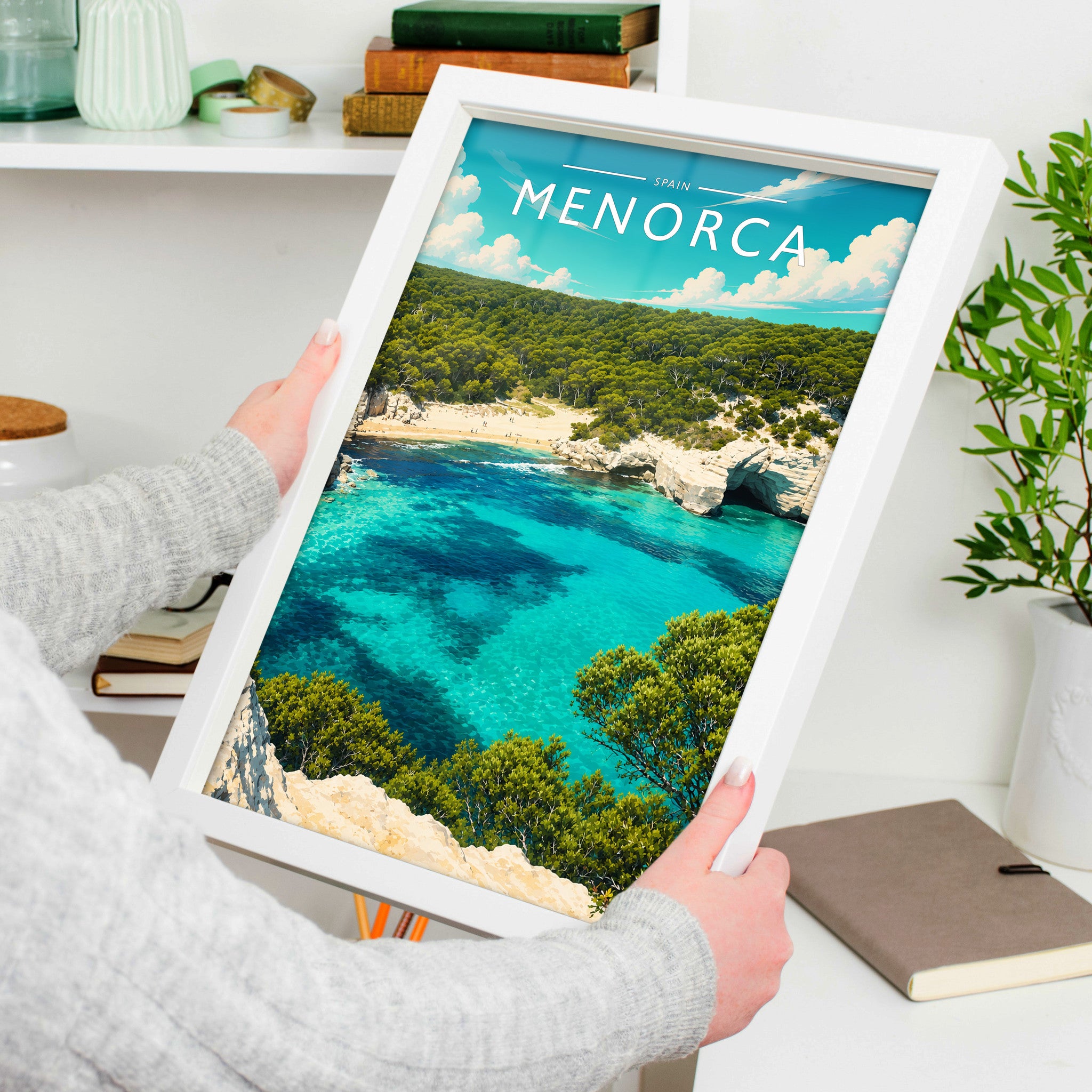 Menorca Travel Poster in a white frame, held to show scale
