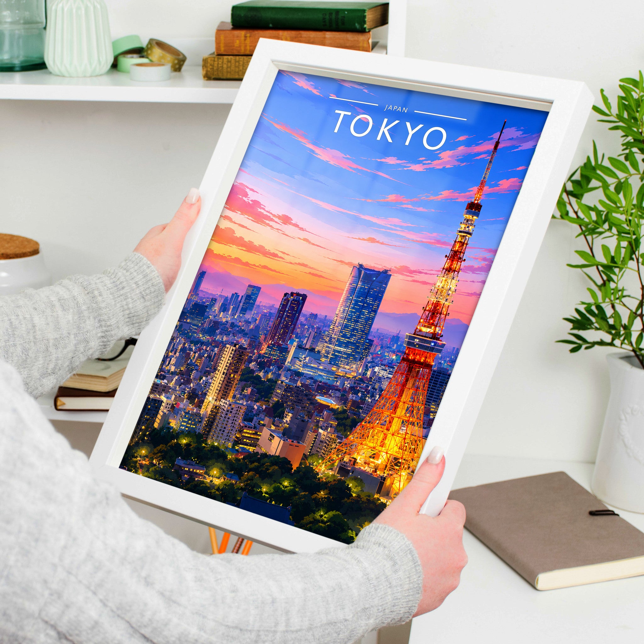 Tokyo Travel Poster in a white frame, held to show scale