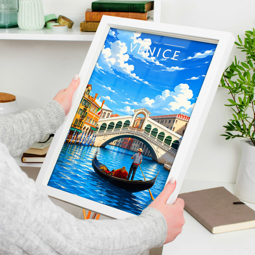 Venice Travel Poster in a white frame, held to show scale
