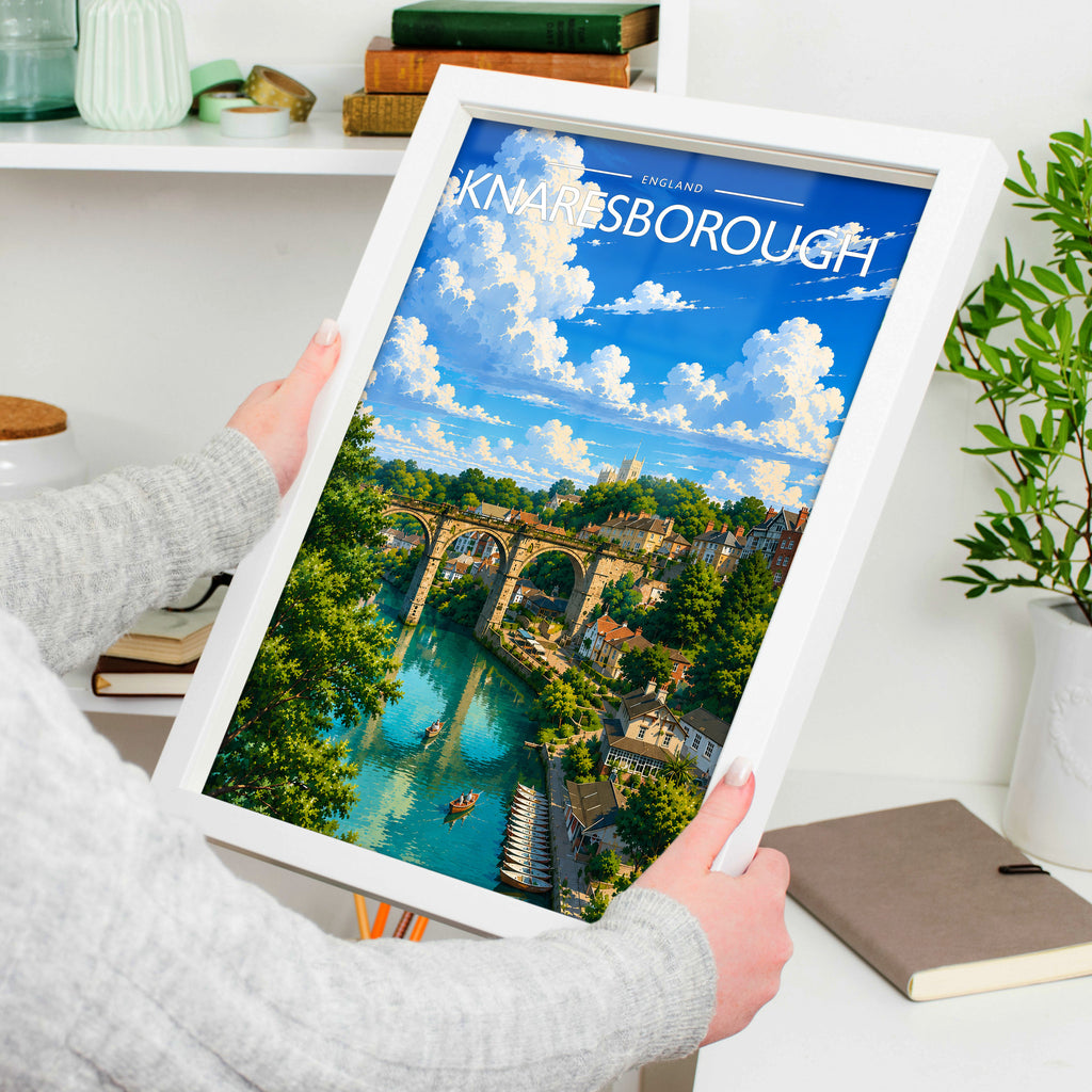 Knaresborough #2 Travel Poster in a white frame, held to show scale