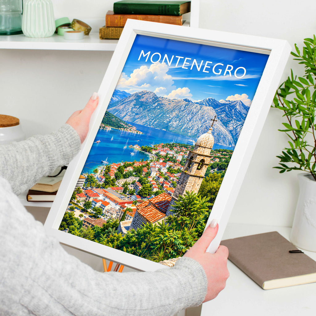 Montenegro Travel Poster in a white frame, held to show scale