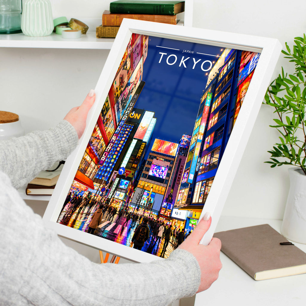 Tokyo #2 Travel Poster in a white frame, held to show scale