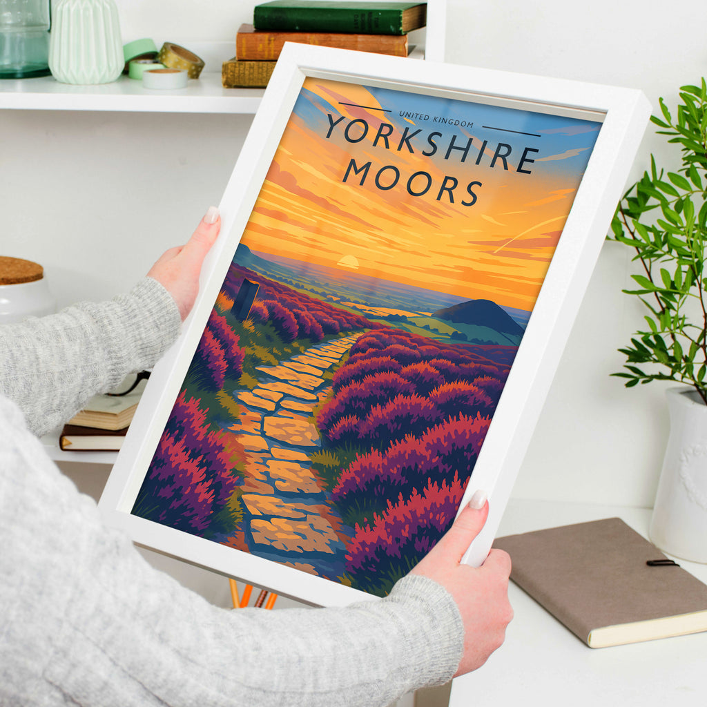 Yorkshire Moors Travel Poster in a white frame, held to show scale