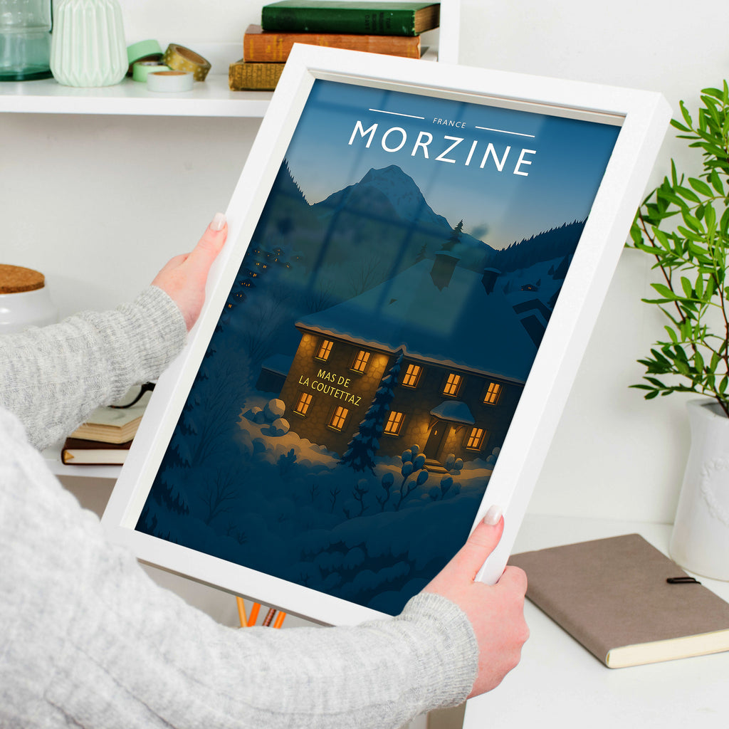 Morzine Travel Poster in a white frame, held to show scale
