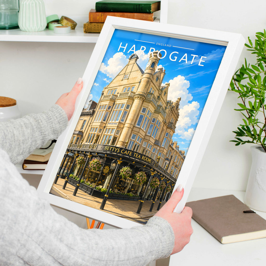 Harrogate #2 Travel Poster in a white frame, held to show scale