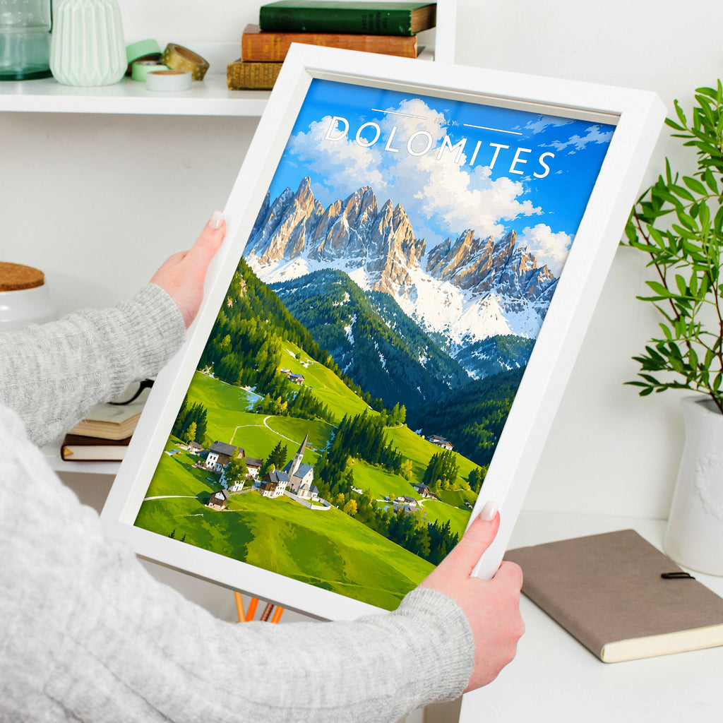 Dolomites Travel Poster in a white frame, held to show scale