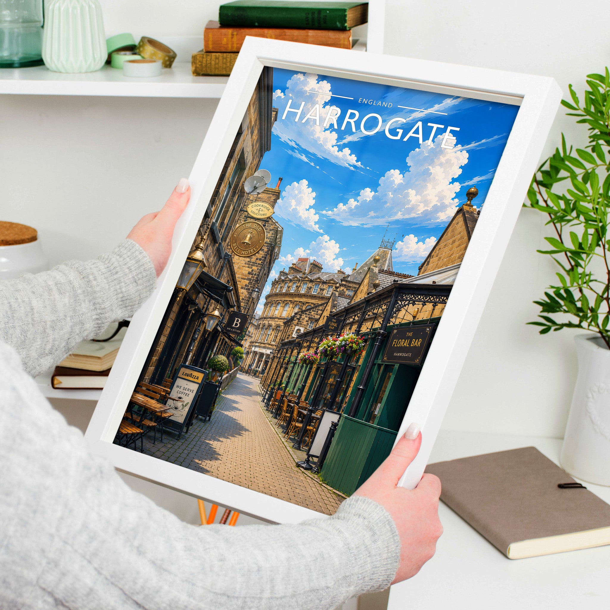 Harrogate #3 Travel Poster in a white frame, held to show scale