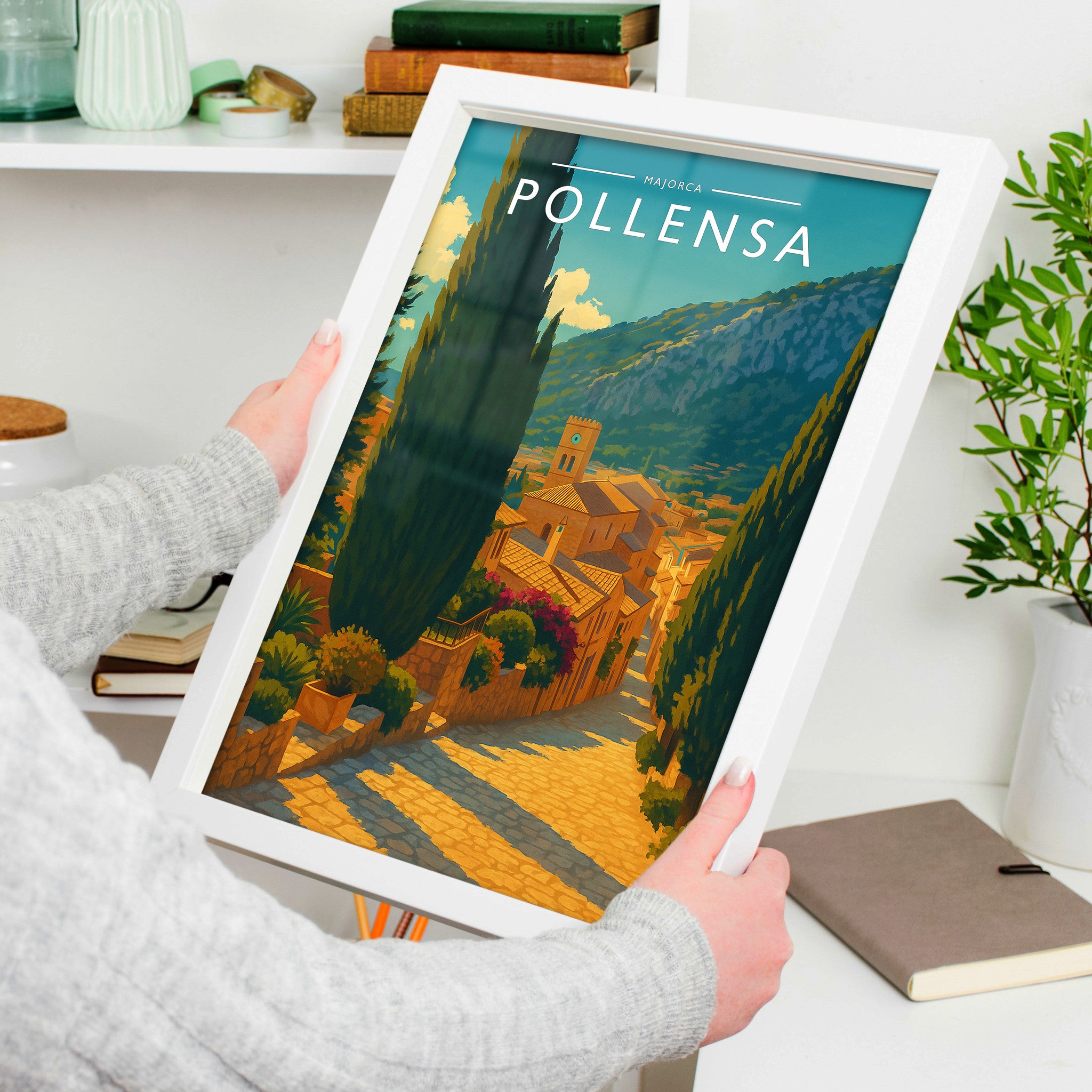 Pollensa Travel Poster in a white frame, held to show scale