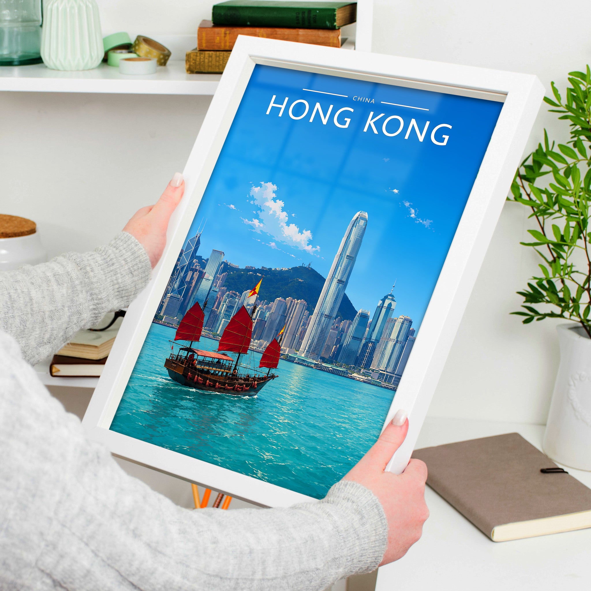 Hong Kong Travel Poster in a white frame, held to show scale