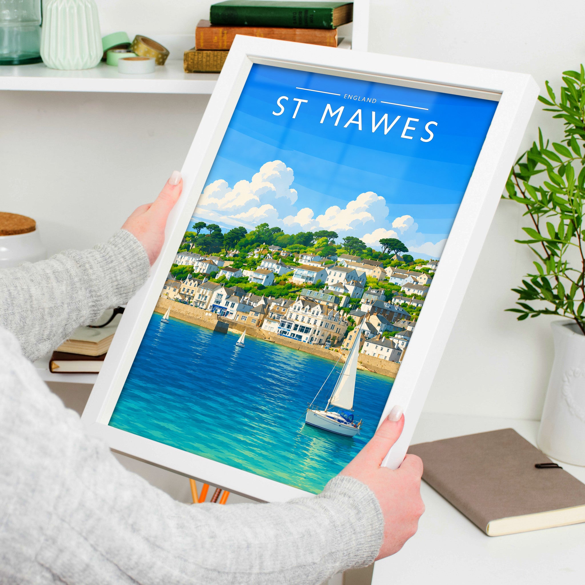 St Mawes Travel Poster in a white frame, held to show scale