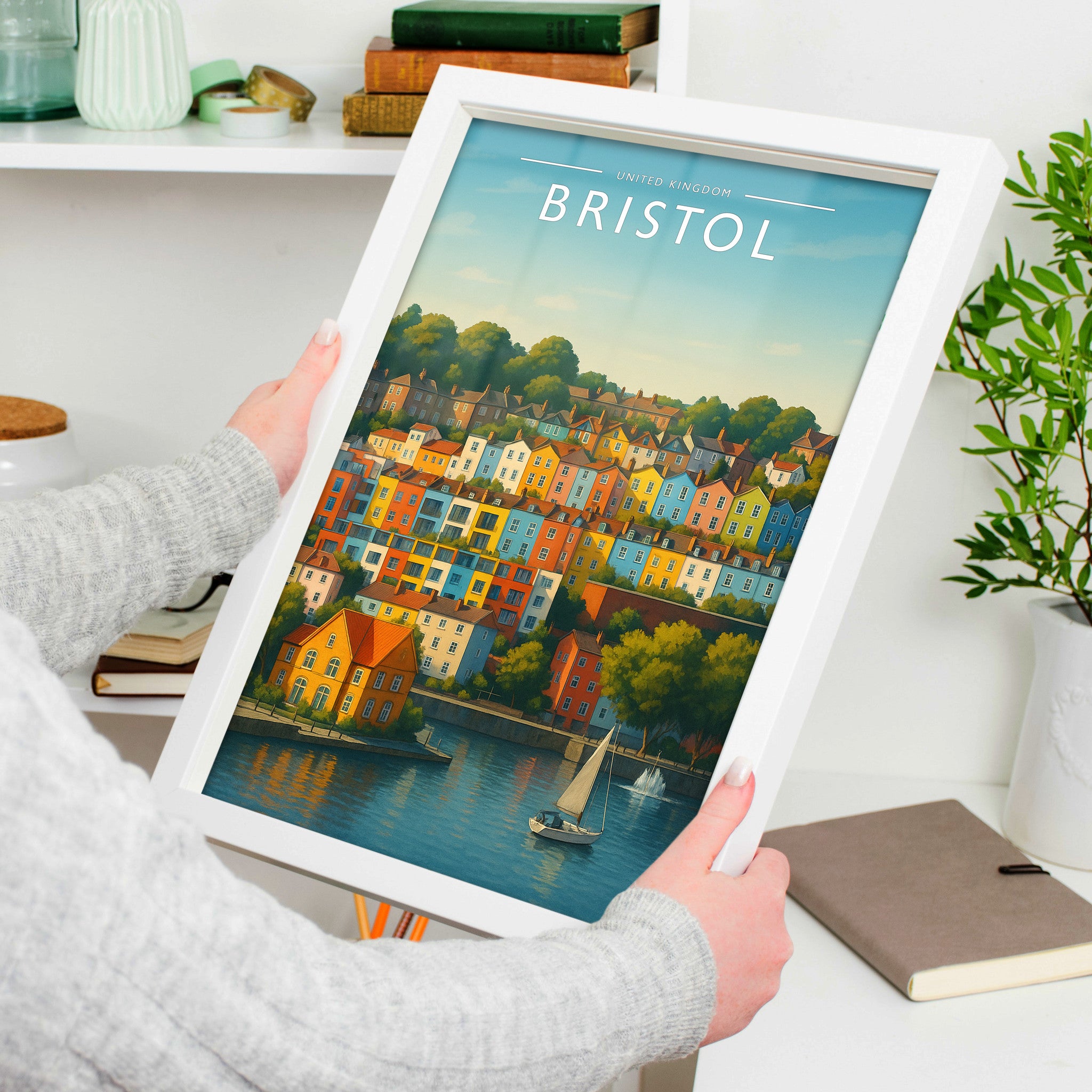 Bristol Travel Poster in a white frame, held to show scale