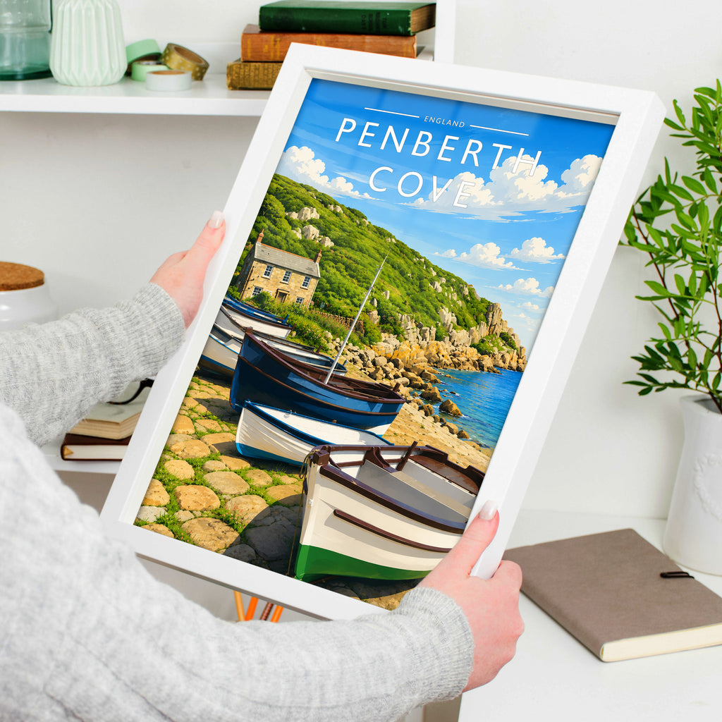 Penberth Cove Travel Poster in a white frame, held to show scale