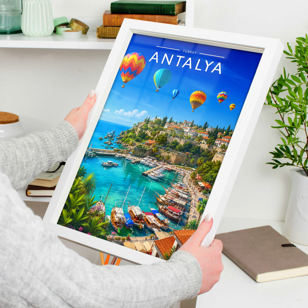 Antalya Travel Poster in a white frame, held to show scale