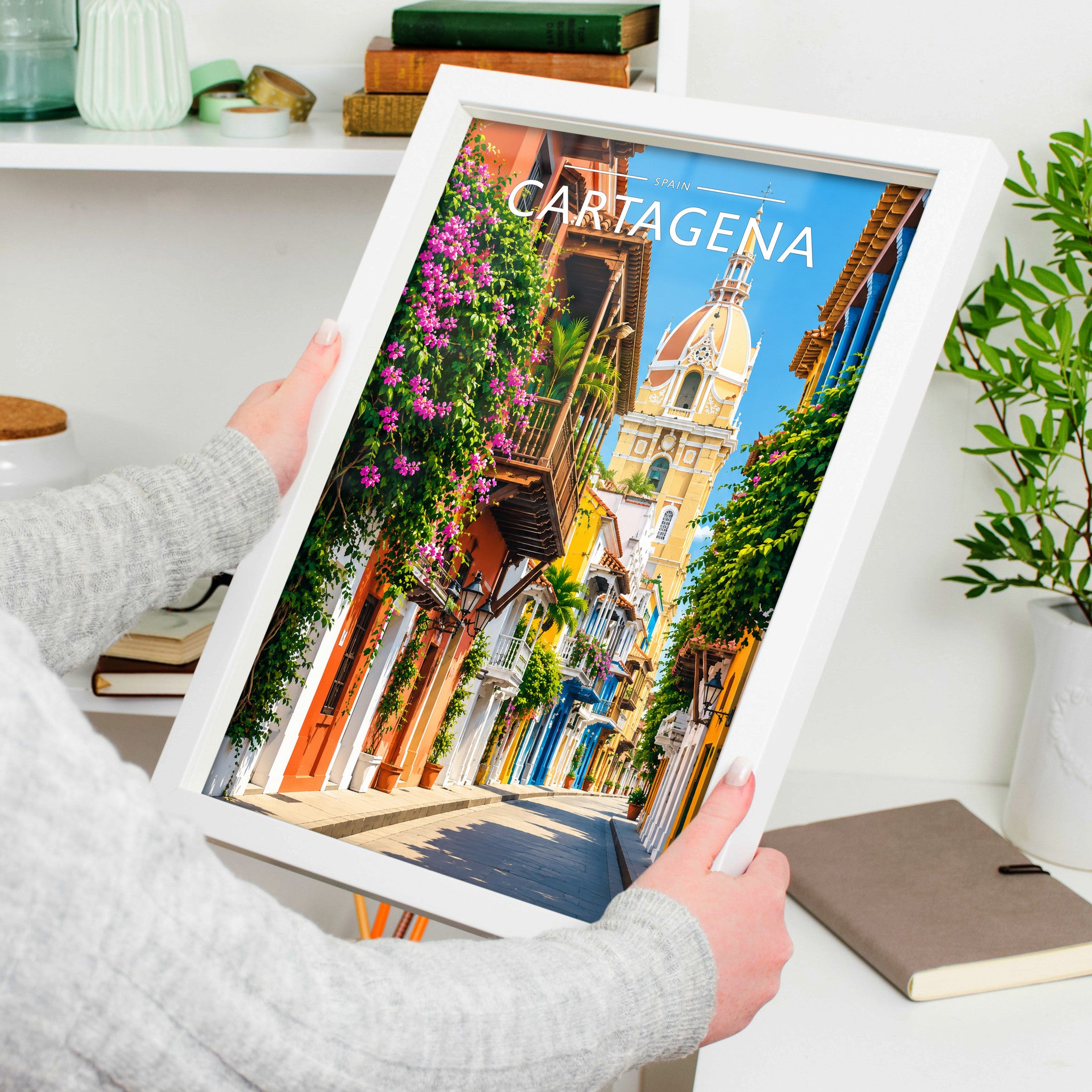 Cartagena Travel Poster in a white frame, held to show scale