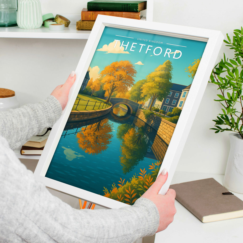 Thetford Travel Poster in a white frame, held to show scale