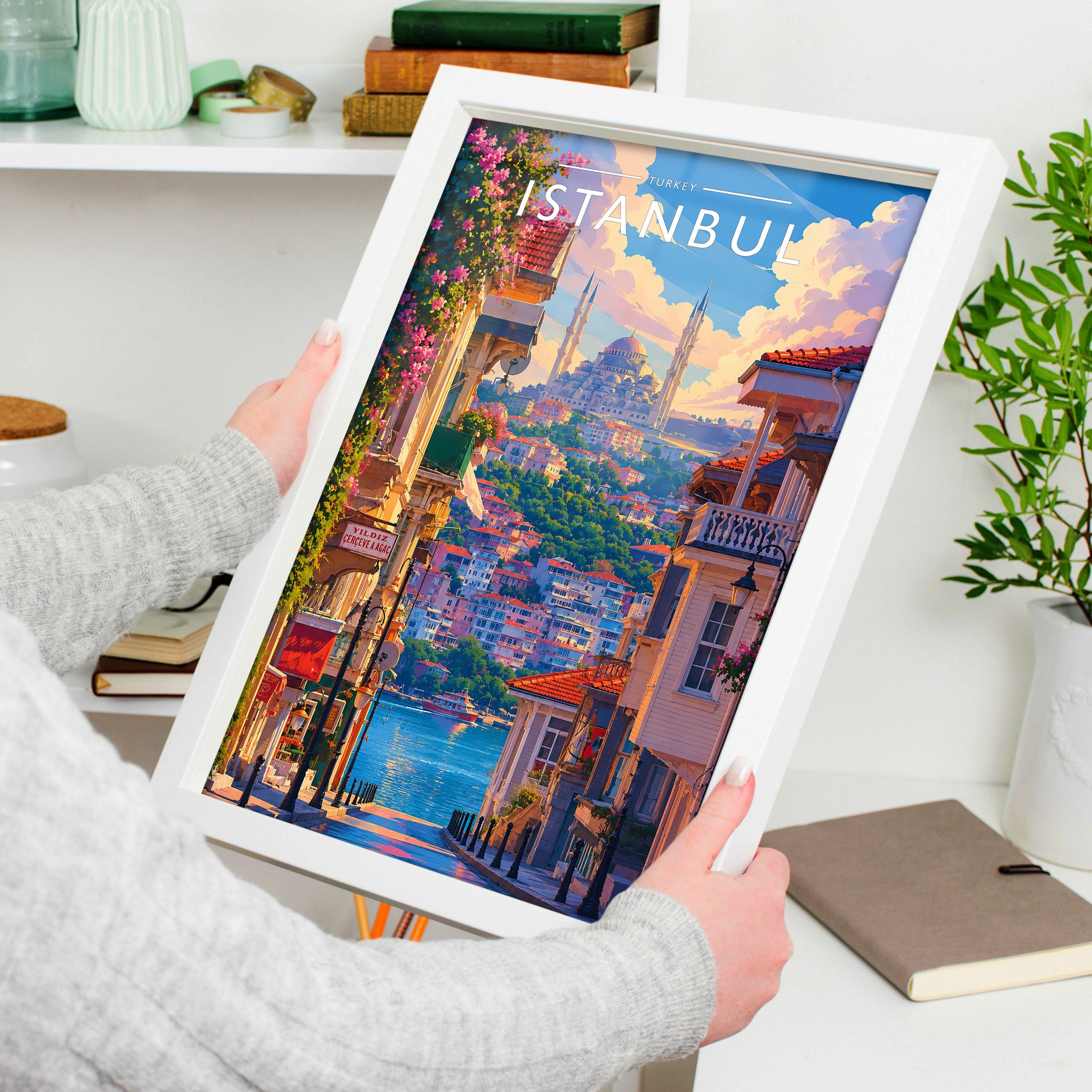 Istanbul Travel Poster in a white frame, held to show scale