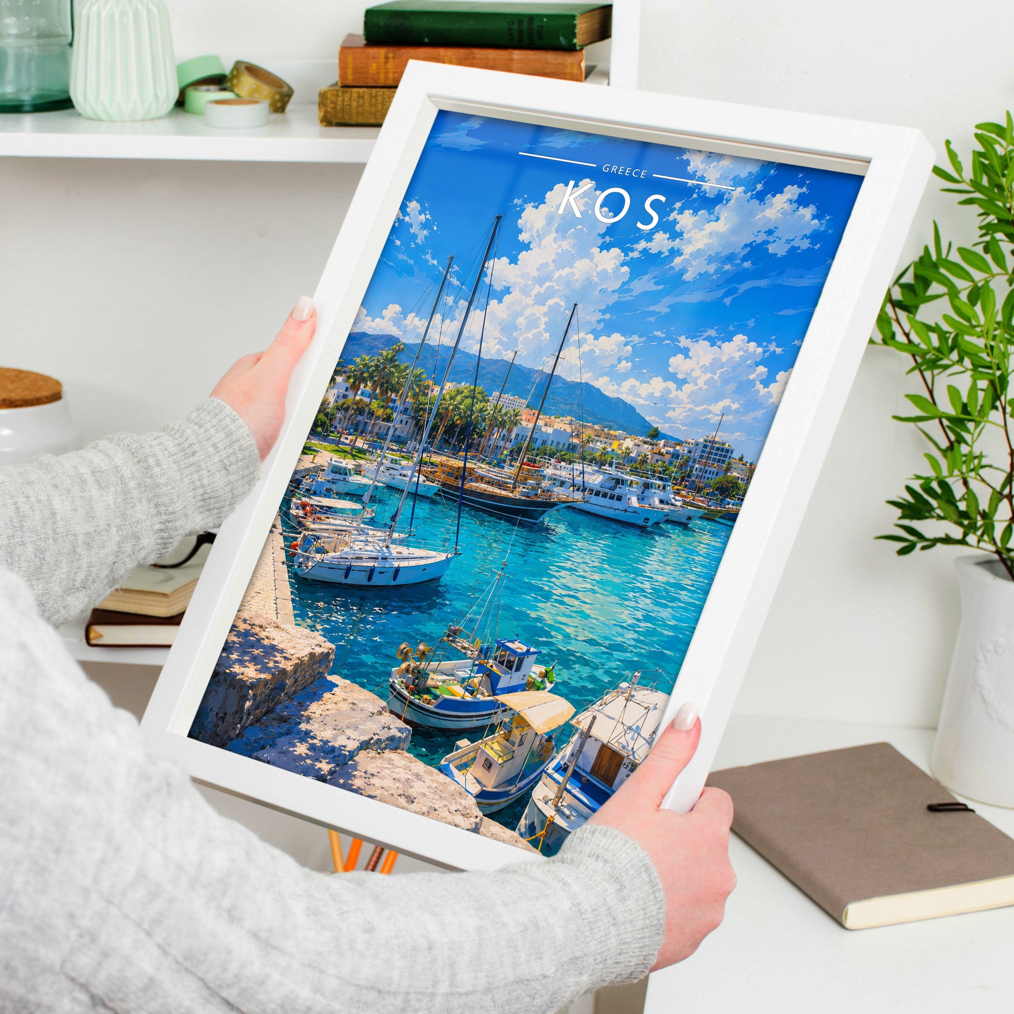 Kos #3 Travel Poster in a white frame, held to show scale