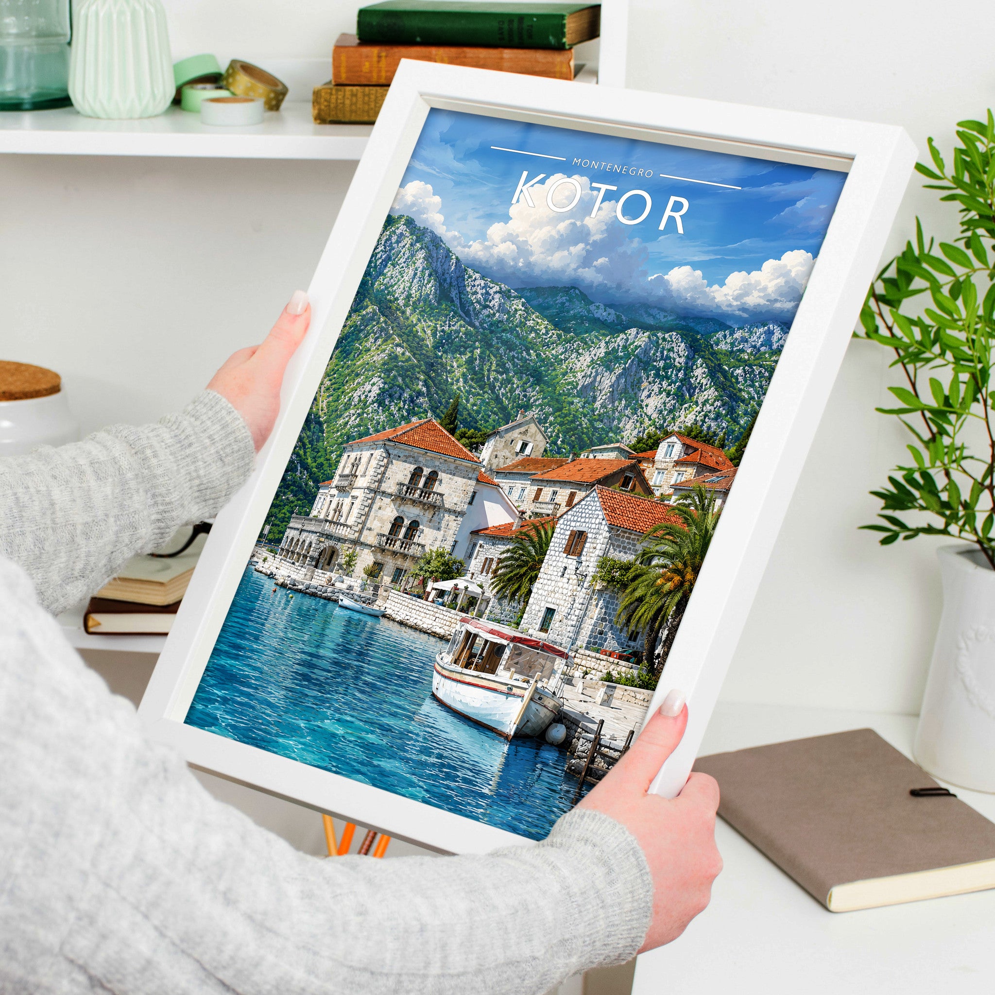 Kotor Travel Poster in a white frame, held to show scale