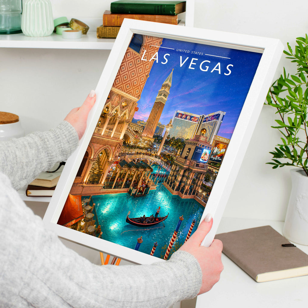 Las Vegas Travel Poster in a white frame, held to show scale