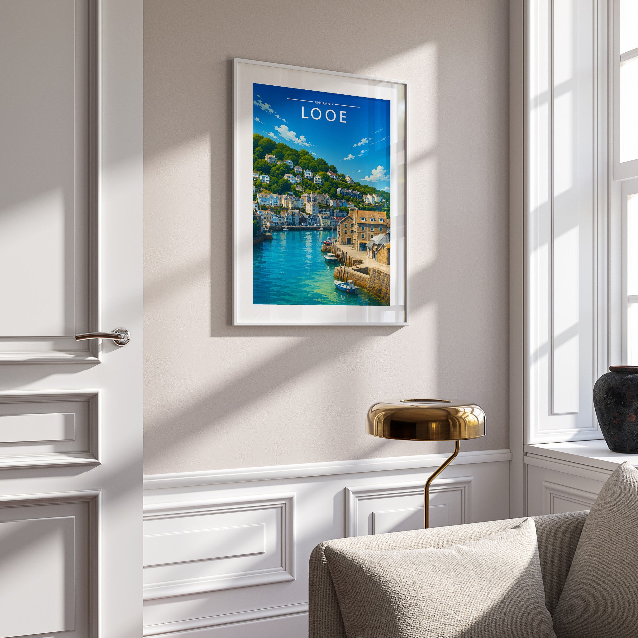 Looe Travel Poster in a white frame on a panelled wall