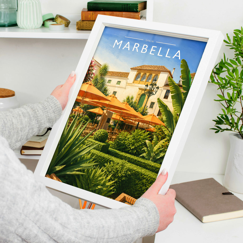 Marbella #3 Travel Poster in a white frame, held to show scale