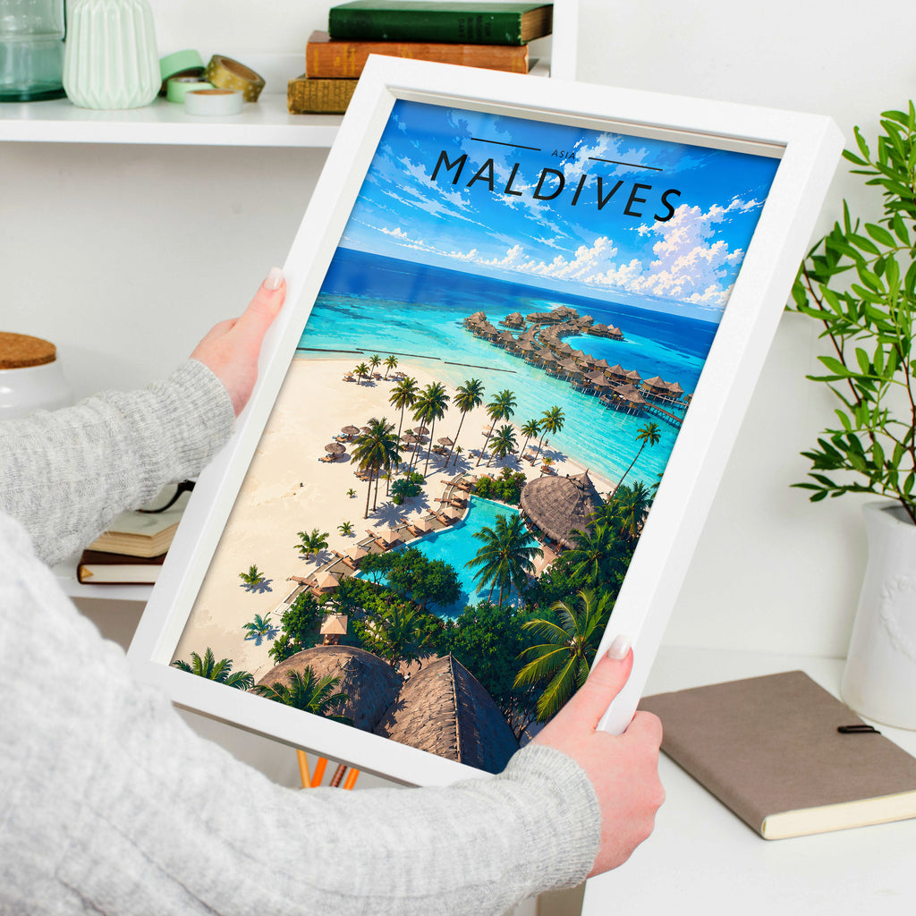 Maldives Travel Poster in a white frame, held to show scale