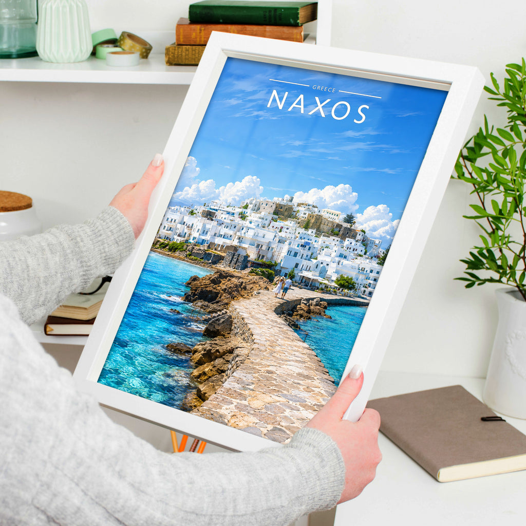 Naxos Travel Poster in a white frame, held to show scale