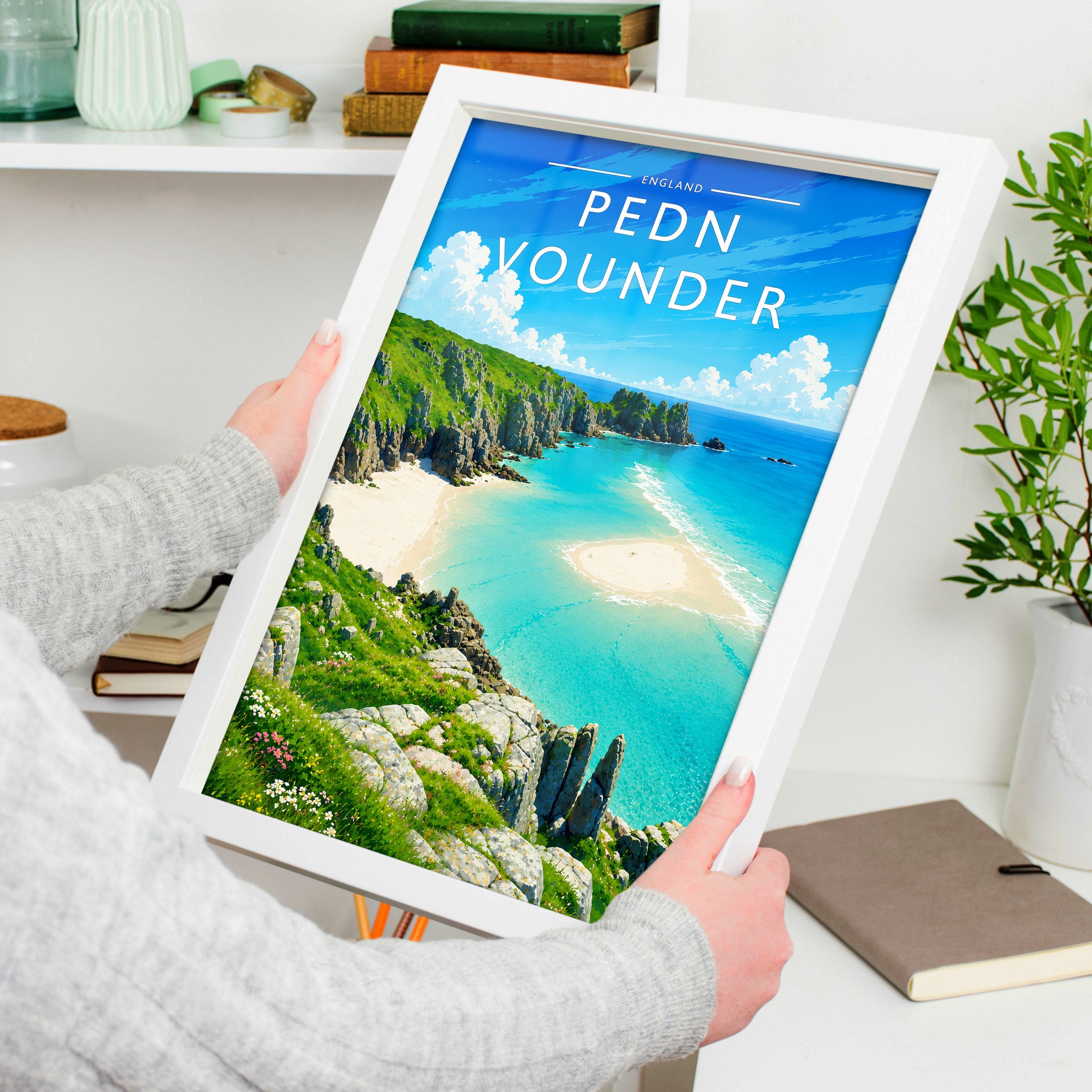 Pedn Vounder Travel Poster in a white frame, held to show scale