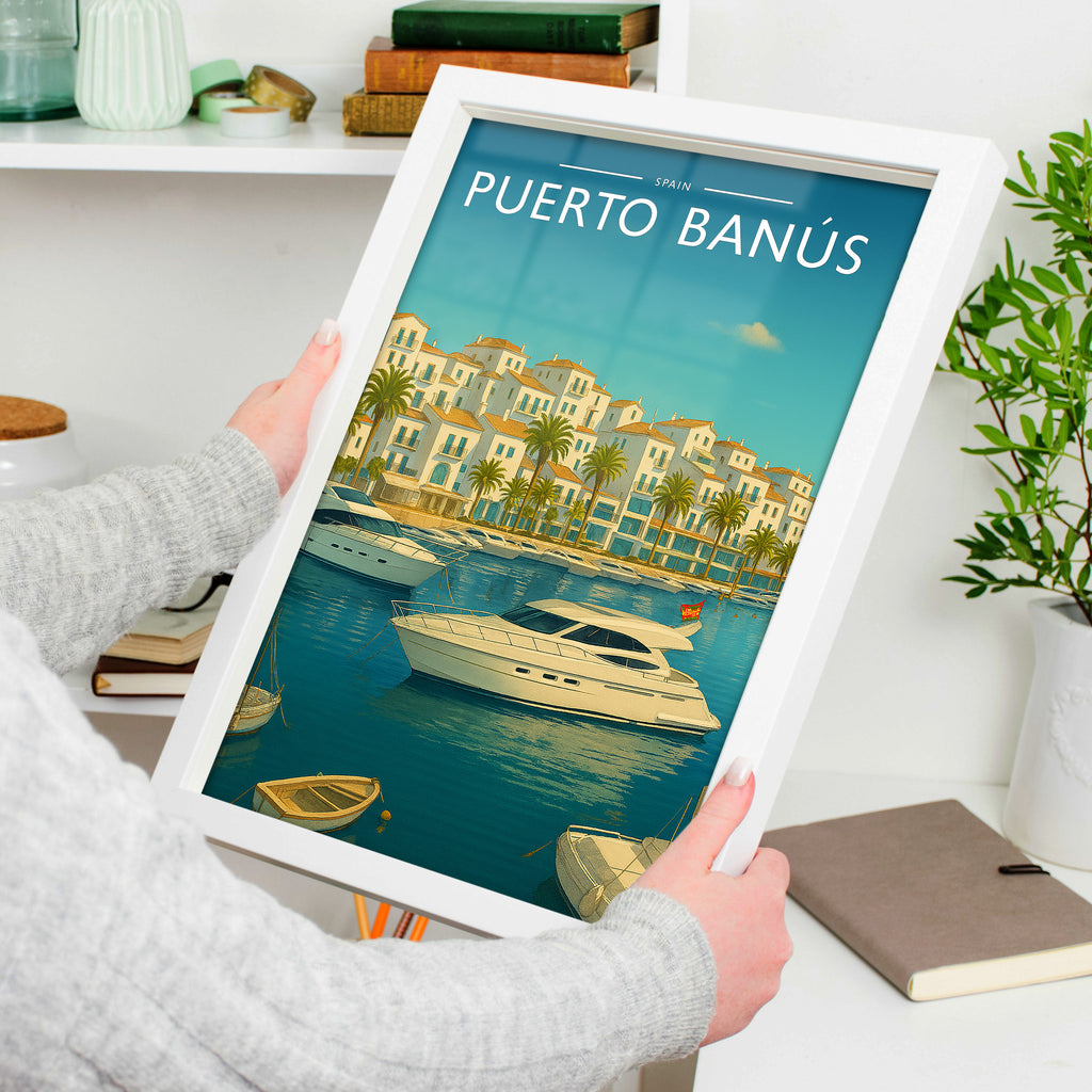Puerto Banús Travel Poster in a white frame, held to show scale