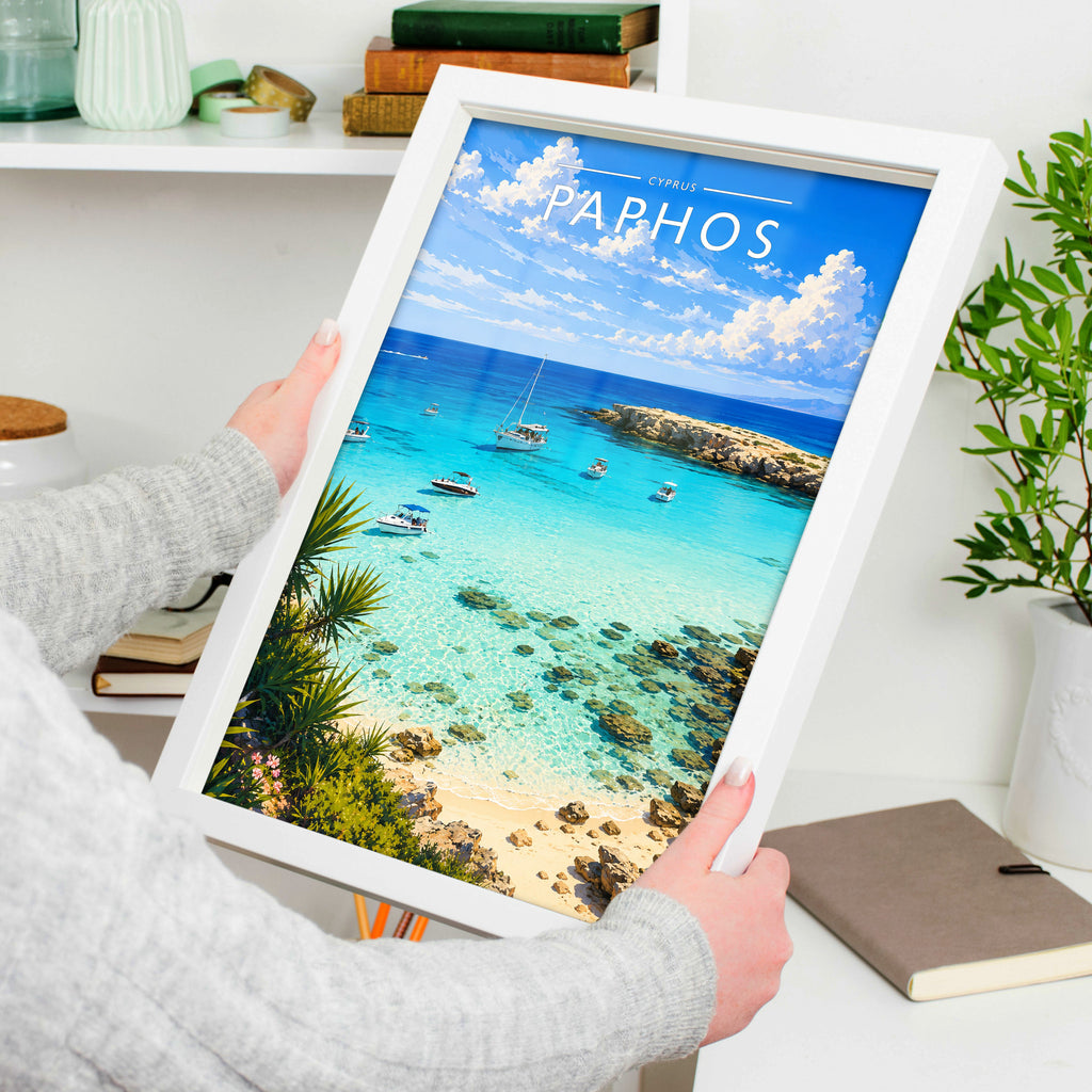 Paphos Travel Poster in a white frame, held to show scale