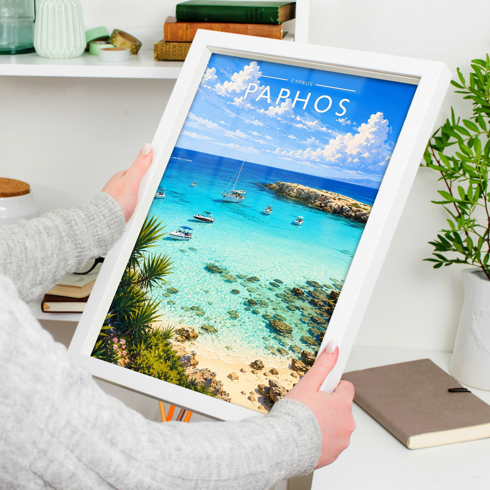 Paphos Travel Poster in a white frame, held to show scale