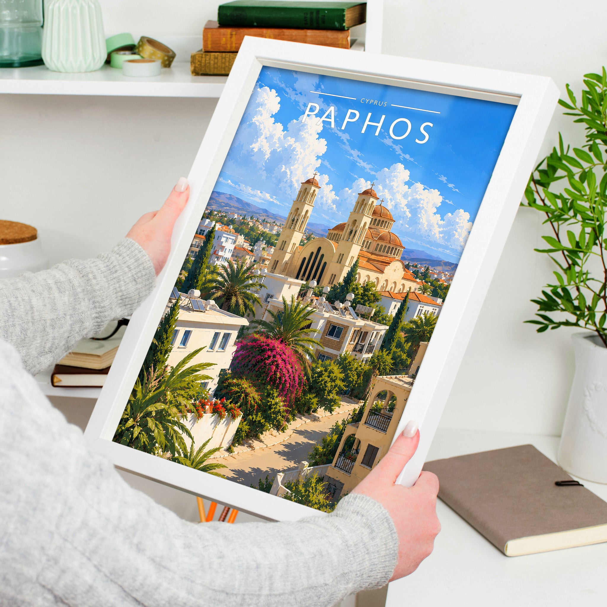 Paphos #2 Travel Poster in a white frame, held to show scale