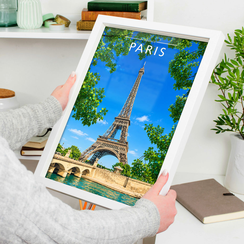 Paris #2 Travel Poster in a white frame, held to show scale