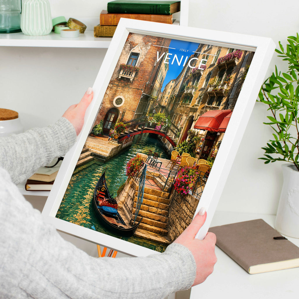 Venice #3 Travel Poster in a white frame, held to show scale