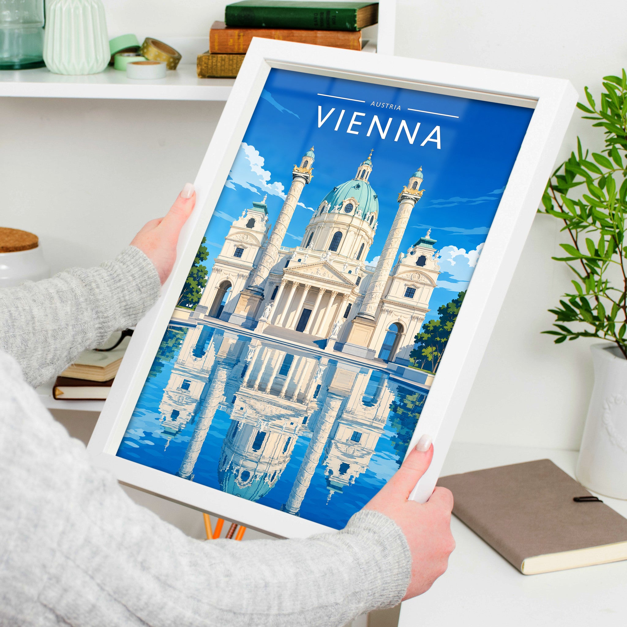 Vienna #2 Travel Poster in a white frame, held to show scale