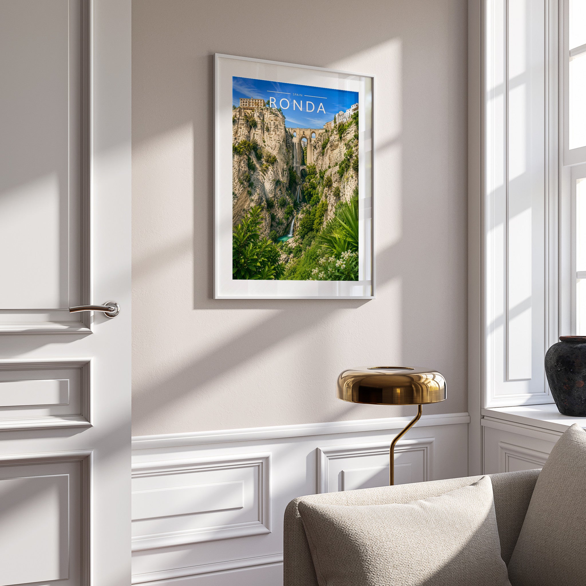 Ronda Travel Poster in a white frame on a panelled wall