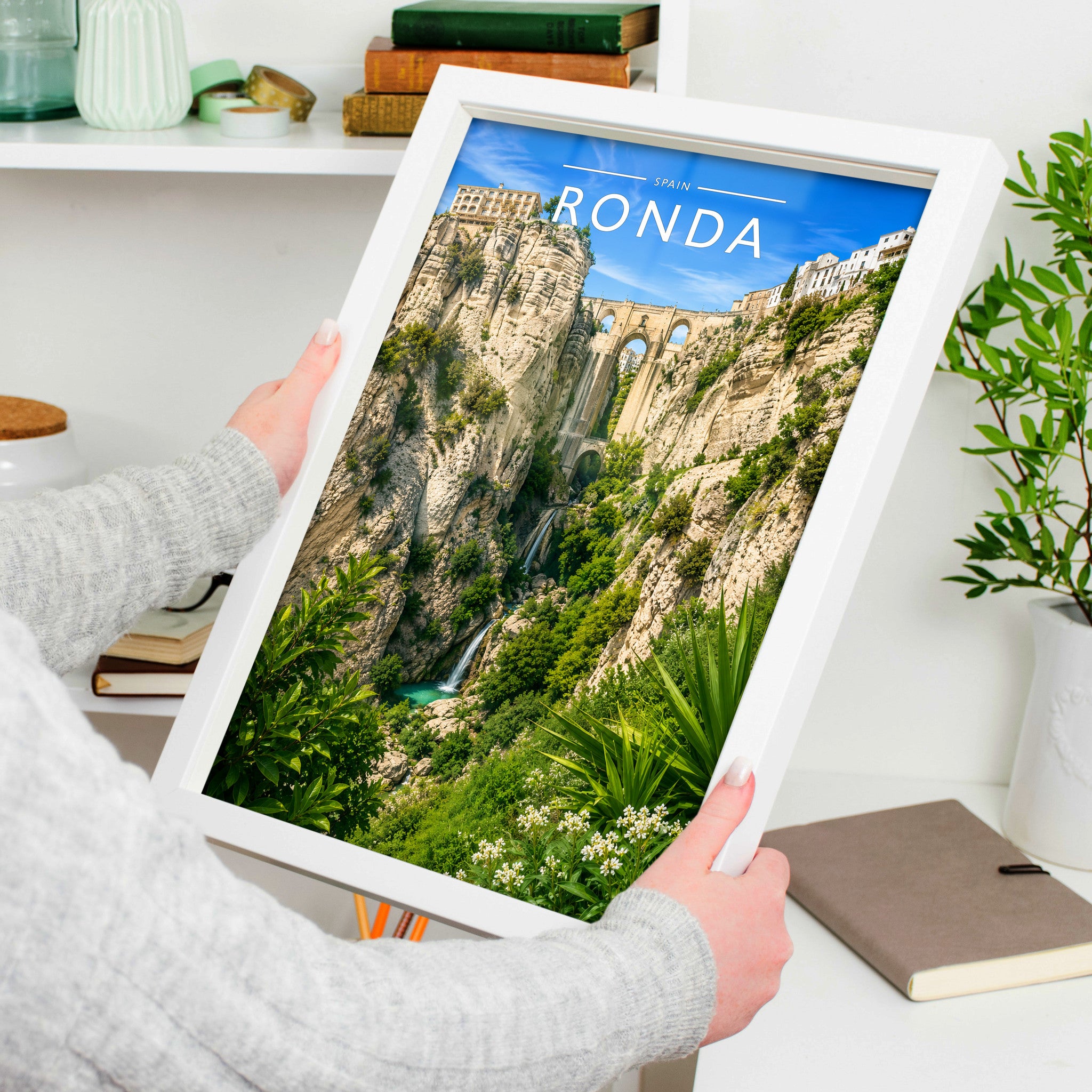 Ronda Travel Poster in a white frame, held to show scale