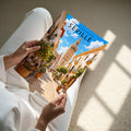 Seville Travel Poster - A4 print held in hand