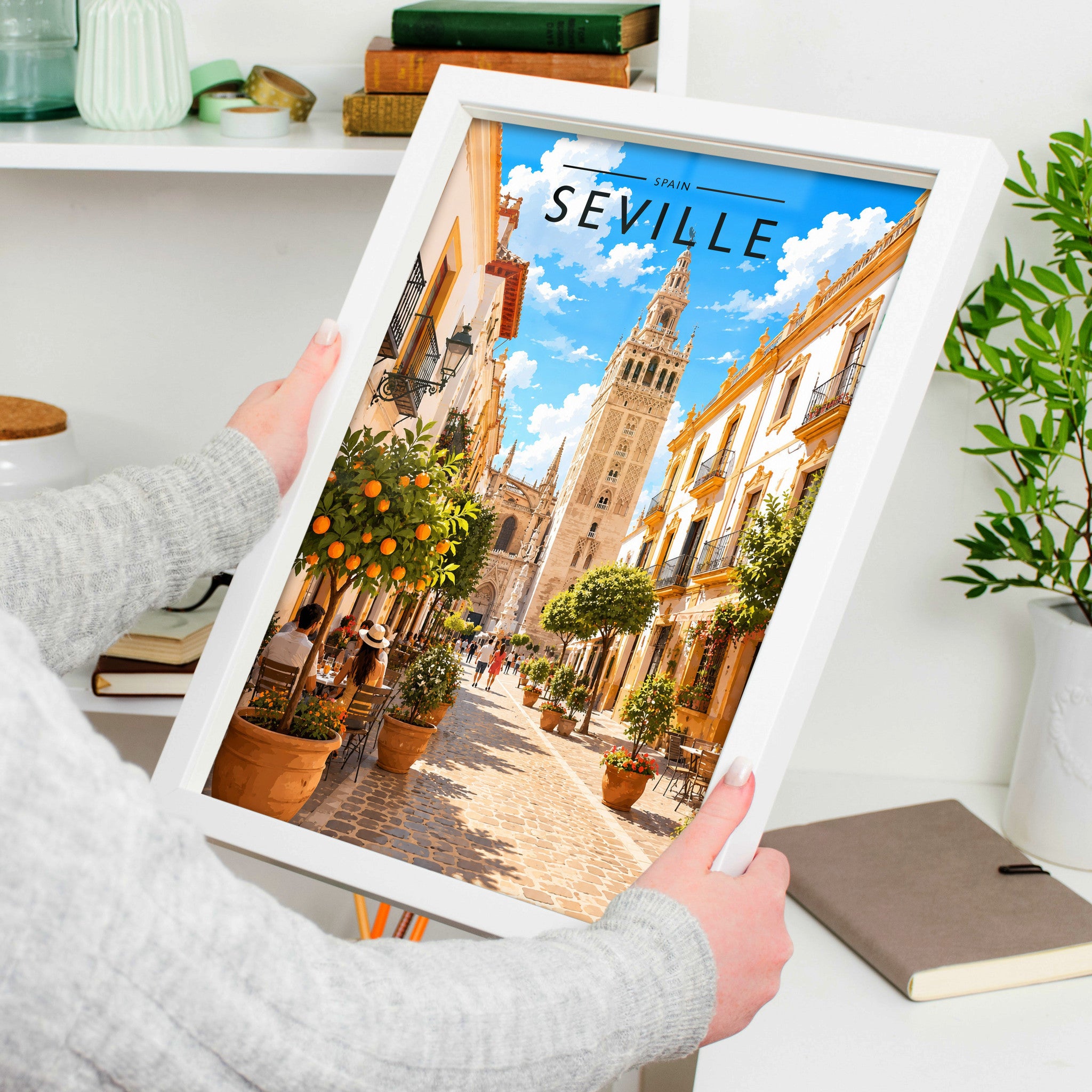 Seville Travel Poster in a white frame, held to show scale