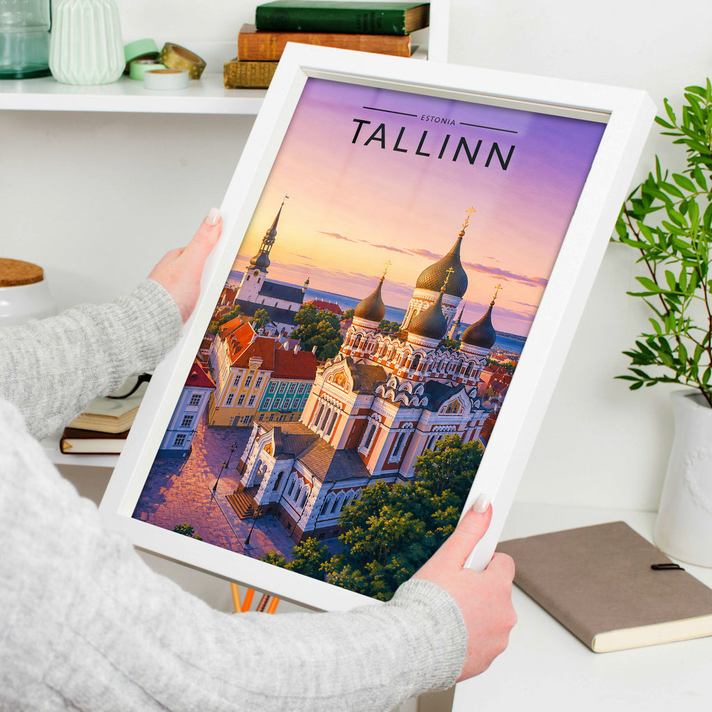 Tallinn Travel Poster in a white frame, held to show scale