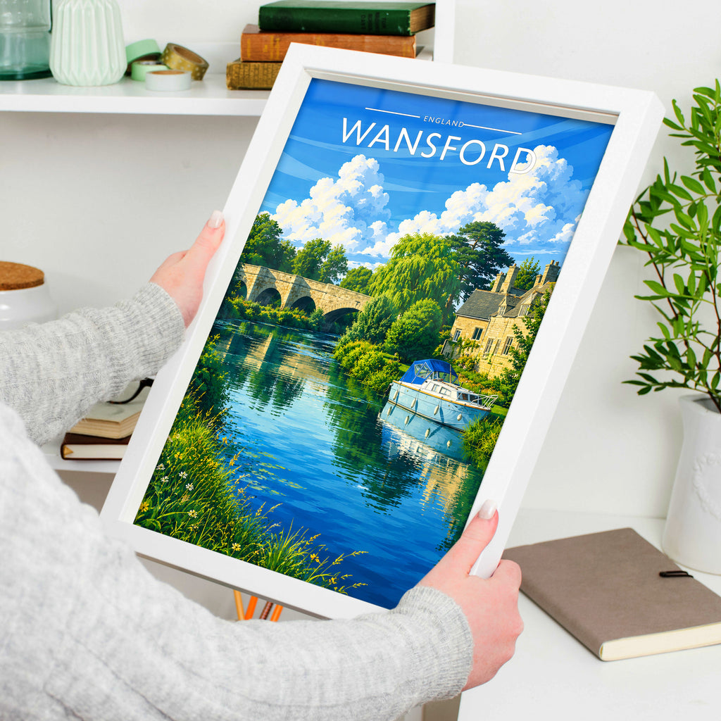 Wansford Travel Poster in a white frame, held to show scale